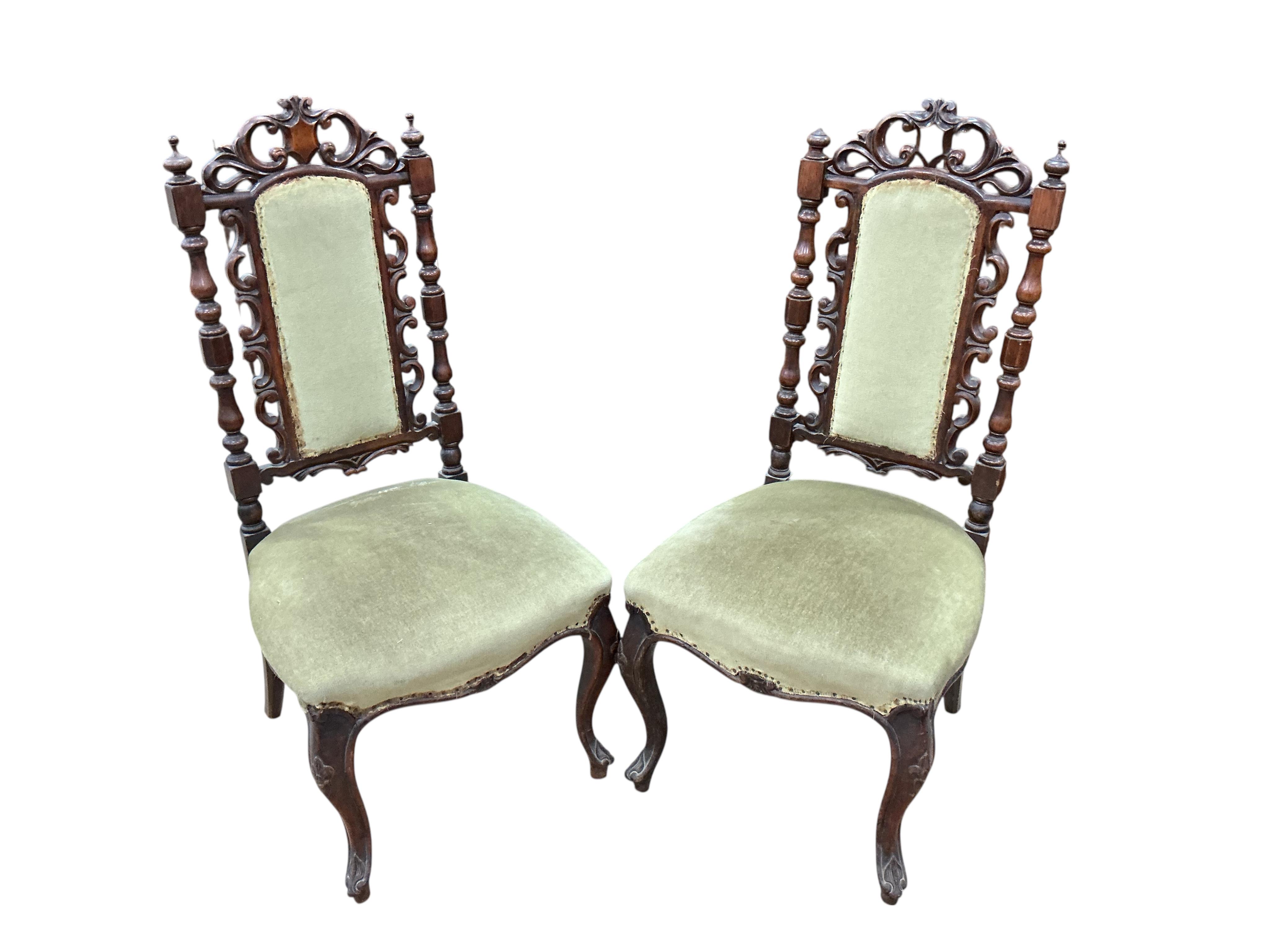 A pair of Victorian carved walnut side chairs, width 46cm, depth 40cm, height 98cm